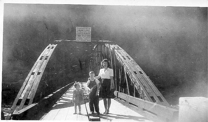 Former Logging Camp residents, Linda, David and Irene pause for a photo on Quartz Creek Bridge in 1948