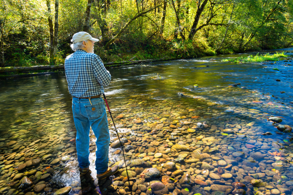 Barry Lopez at the McKenzie River, photo by Tim Giraudier/Beautiful Oregon